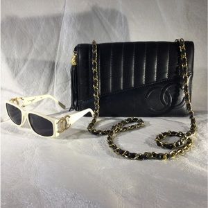 CHANEL sunglasses and Vintage 60’s lamb skin clutch with shoulder strap.